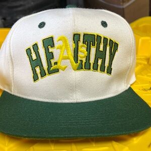 Larry June Oakland A’s Green and White Healthy Cap
